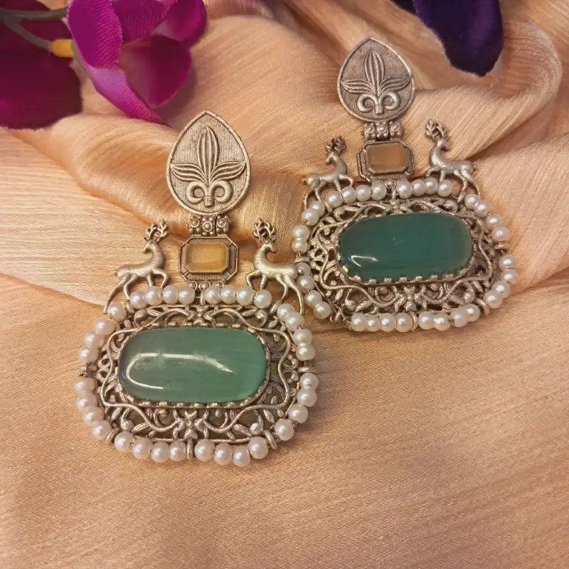 20250808_134541 Lightweight oxidized silver jhumka with teal Monalisa stone and pearl for festive wear